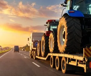 vehicles-road-against-orange-sky-scaled.jpg
