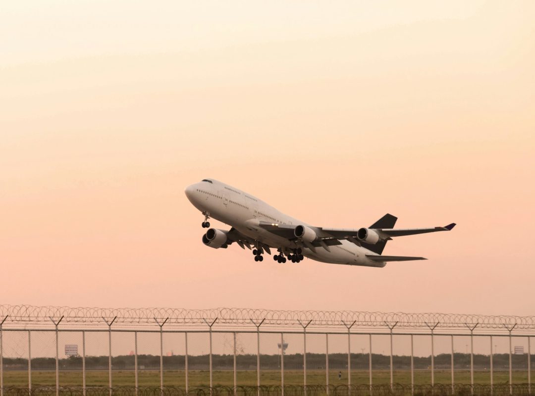 airplane-taking-off-on-airport-runway-at-sunset-sky-background-air-logistics-and-transportation.jpg