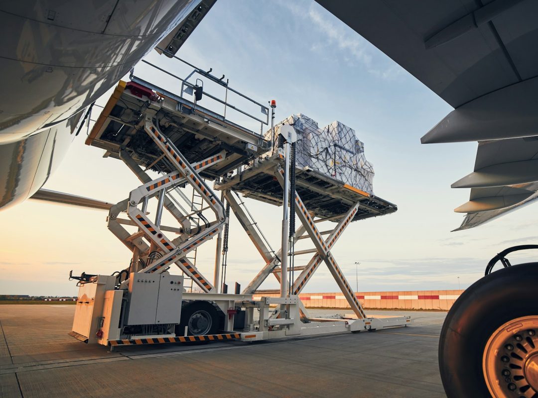 loading-of-cargo-containers-to-airplane-at-sunset.jpg